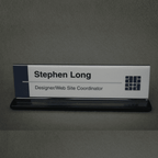 Double-sided office cubicle nameplate sign frame with aluminum base in black, angled view