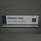 Double-sided office cubicle nameplate sign frame with aluminum base in satin silver, angled view